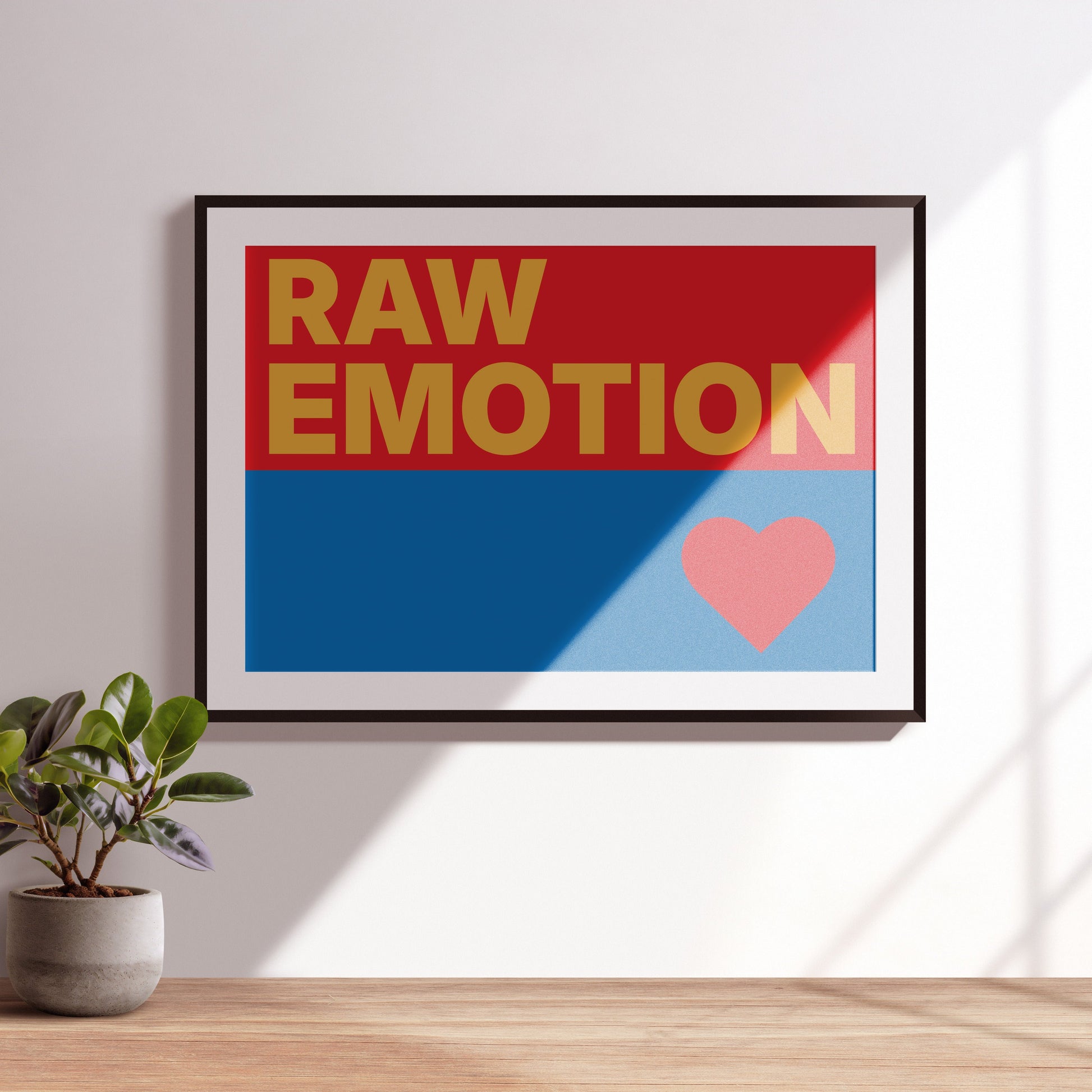 Raw Emotion in orange on a red and blue with a heart. 